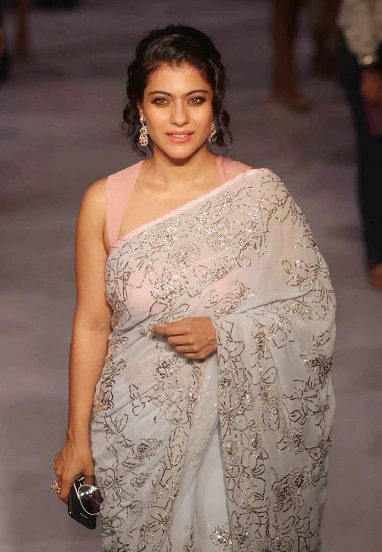 kajol bollywood actress with sleeveless blouse with white saree 