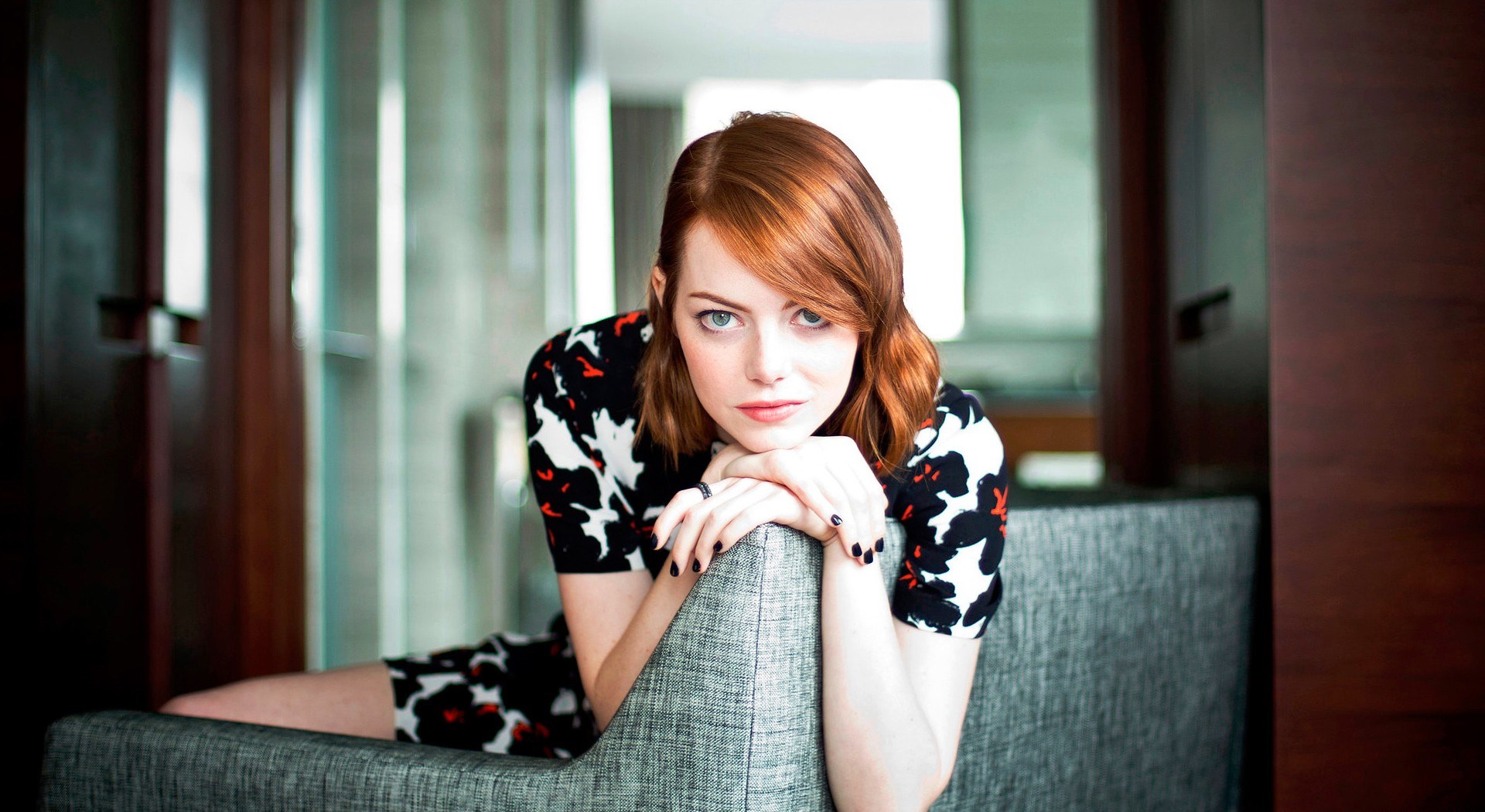 download emma stone lovely pose in sofa back still free mobile hd background wallpaper