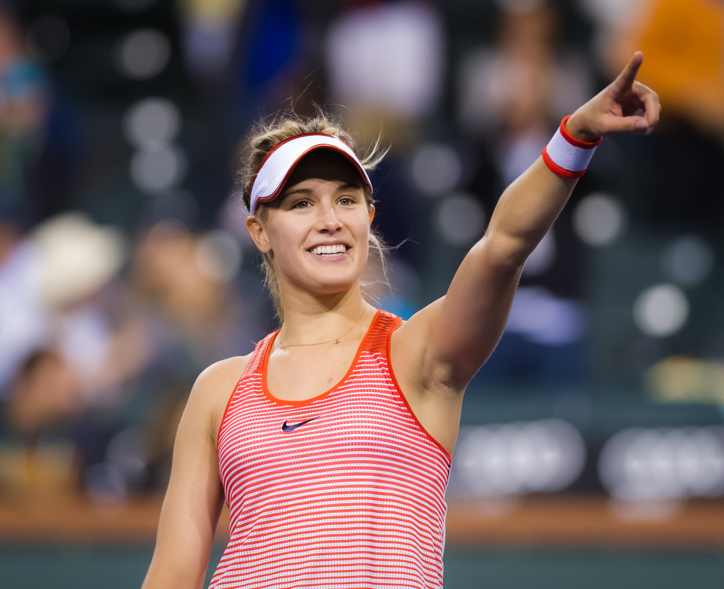 amazing eugenie bouchard cute smile with showing hand to audience pose background wallpaper free hd mobile