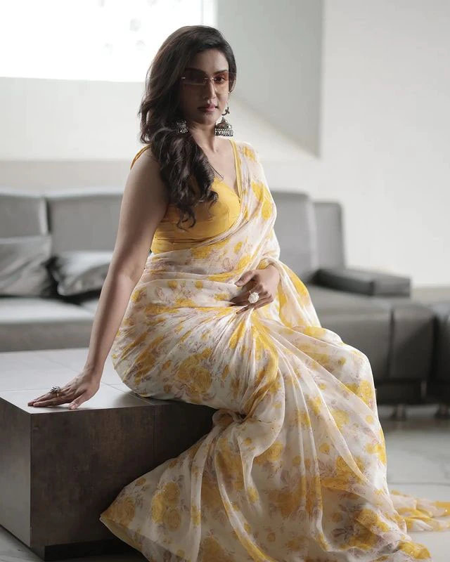 honey rose glamorous look in yellow saree and cooling glass photos